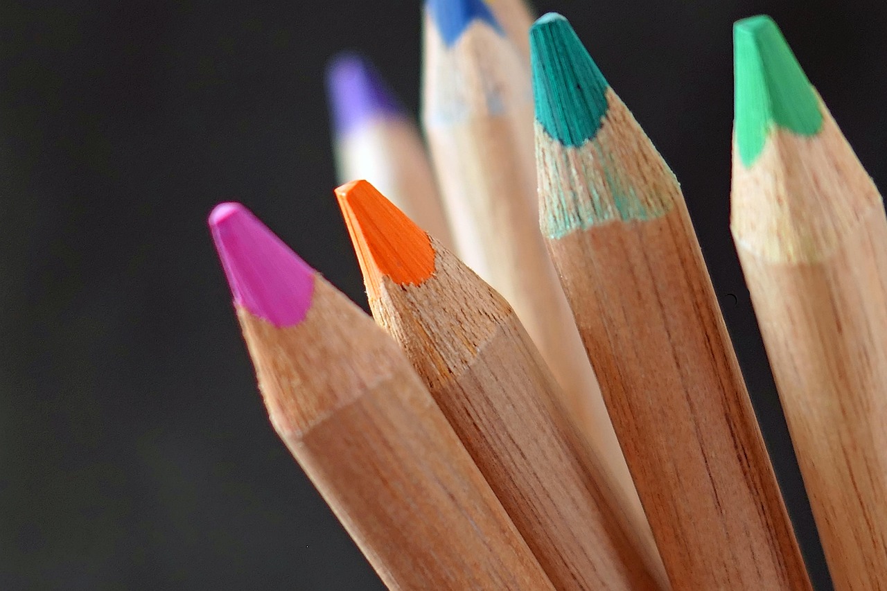 Close-up of vibrant coloring pencils arranged neatly, showcasing a range of colors.