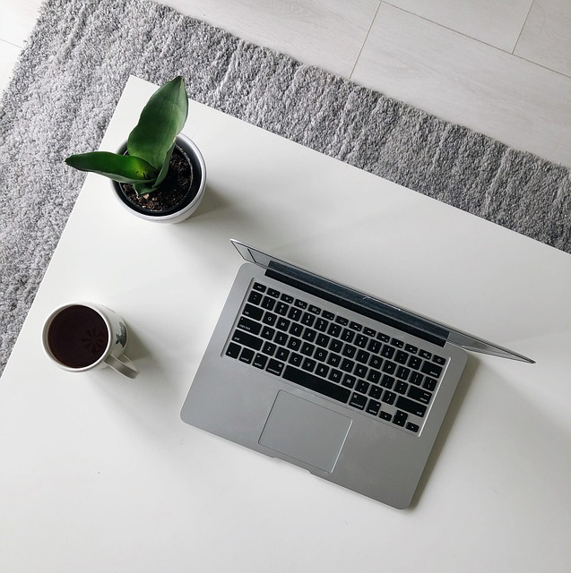 A laptop on a tidy desk with a modern design, creating a productive workspace.