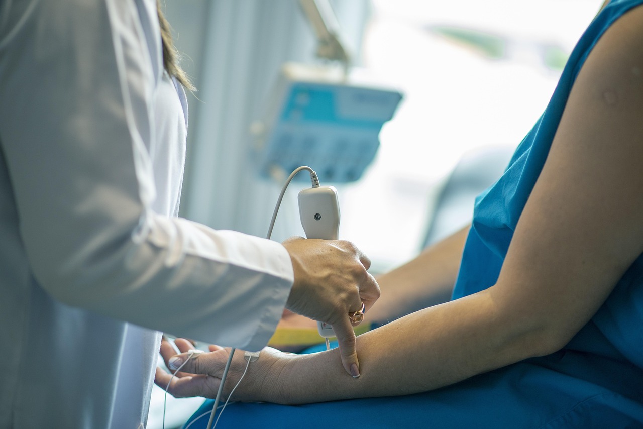 A patient sitting in a doctor's office, being examined by a medical professional, representing the side hustle of earning money through paid clinical trials.